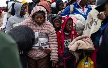 In photos: Displaced Zimbabweans moved to repatriation site in the rain