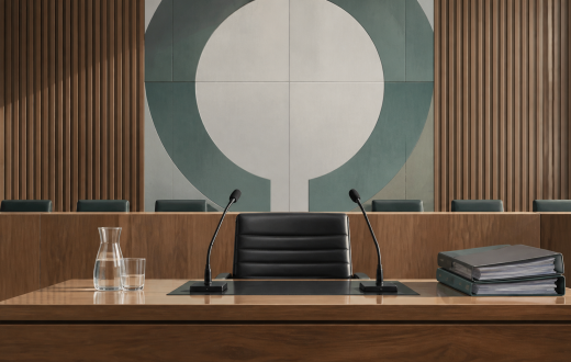 Illustrated empty commission hearing desk with two microphones and case files