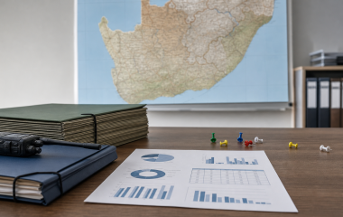 Illustrated public-safety planning desk with folders, radio and anonymous charts