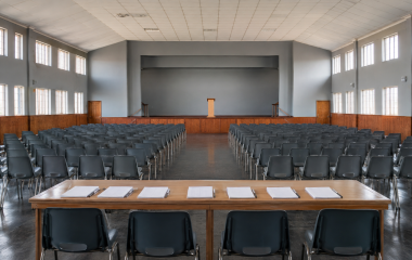 Empty neutral community hall prepared for a civic meeting