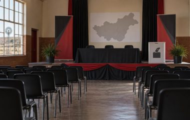 An empty North West community hall prepared for a local-election meeting