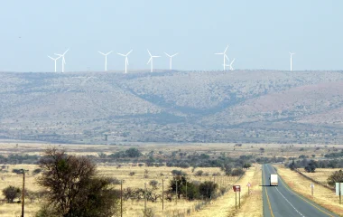 Wind turbines on ridges beyond the N10 near Cookhouse in the Eastern Cape, photographed in 2014.