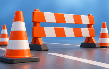 Conceptual illustration of traffic cones and a road barrier; no actual location or operation depicted.